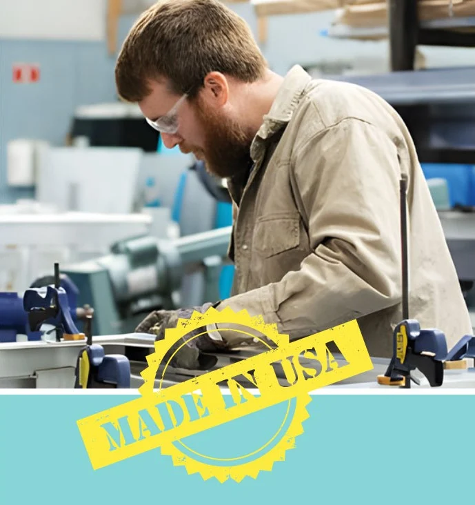 Affordable Elevator Website – Homepage Lifestyle hero Manufacturer working with tools in a workshop, wearing safety glasses. "Made in USA" stamp in yellow, relevant to home elevators industry.