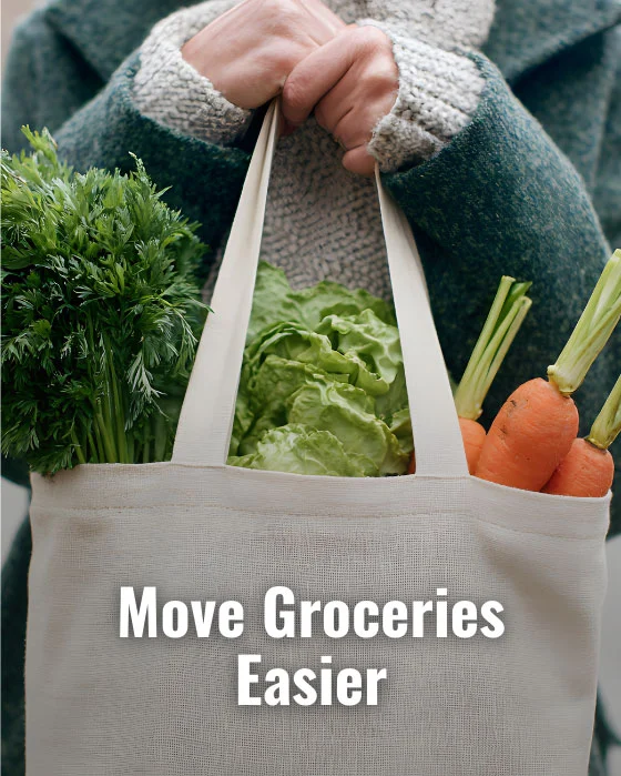 Person holding a tote with carrots, lettuce, and greens. Text overlay reads, "Move Groceries Easier," suggesting the convenience of home elevators.